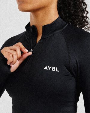 Empower Seamless 1/2 Zip Jacket - Black: The Ultimate Sculpting Gym Essential