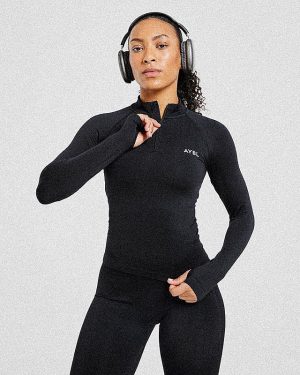 Empower Seamless 1/2 Zip Jacket - Black: The Ultimate Sculpting Gym Essential
