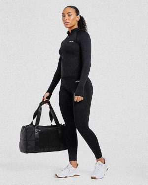 Empower Seamless 1/2 Zip Jacket - Black: The Ultimate Sculpting Gym Essential